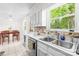 Bright kitchen with ample cabinet space and an adjacent dining area at 4901 White Oak Rd, Charlotte, NC 28210