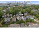 Aerial view of a house in a neighborhood with a city skyline in the distance at 615 Welker St, Charlotte, NC 28204