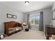 Comfortable bedroom with a window letting in lots of light, plus a cozy chair and bed at 615 Welker St, Charlotte, NC 28204