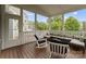 Relaxing covered porch featuring a comfortable lounge set and serene outdoor views at 615 Welker St, Charlotte, NC 28204