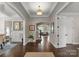 Inviting foyer with hardwood floors, tray ceilings, and an open layout seamlessly connecting to the living spaces at 615 Welker St, Charlotte, NC 28204