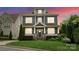 Charming two-story home featuring a well-manicured front lawn, inviting entrance, and classic design at 615 Welker St, Charlotte, NC 28204