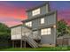 Rear exterior view highlighting the deck, screened-in porch, and multi-level design at 615 Welker St, Charlotte, NC 28204
