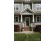 Inviting front porch with stone accents, fresh landscaping, and stylish details creates a welcoming entrance at 615 Welker St, Charlotte, NC 28204