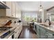 Well-appointed kitchen with modern appliances, granite countertops, and ample natural light at 615 Welker St, Charlotte, NC 28204