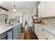 Spacious kitchen with stainless steel appliances, granite countertops, and adjacent breakfast area at 615 Welker St, Charlotte, NC 28204