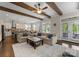 Open-concept living room and kitchen with french doors, two sofas, and a large area rug at 615 Welker St, Charlotte, NC 28204