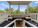 Covered patio with comfortable sectional seating offering a relaxing outdoor space at 615 Welker St, Charlotte, NC 28204