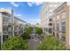 Street view showcasing apartment buildings with tree lined median at 615 Welker St, Charlotte, NC 28204