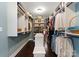Spacious walk-in closet featuring custom shelving and storage, as well as a center island at 615 Welker St, Charlotte, NC 28204