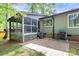 This backyard shows a screened porch, stone patio, and well-maintained landscaping for outdoor enjoyment at 6712 Santa Maria Ln, Charlotte, NC 28227