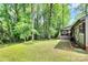 Expansive backyard with mature trees, offering privacy and natural beauty at 6712 Santa Maria Ln, Charlotte, NC 28227
