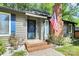 Close-up of the home's entrance with brick steps, house numbers, and neat landscaping at 6712 Santa Maria Ln, Charlotte, NC 28227