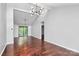 Open living space with hardwood floors, recessed lighting, and access to the patio through a sliding glass door at 6712 Santa Maria Ln, Charlotte, NC 28227