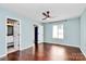 Main bedroom features a ceiling fan, hardwood floors, and an ensuite bath at 6712 Santa Maria Ln, Charlotte, NC 28227