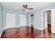Spacious main bedroom with ceiling fan, closet, ensuite bathroom and hardwood floors at 6712 Santa Maria Ln, Charlotte, NC 28227