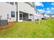 Spacious backyard with screened-in patio and lush green lawn at 7004 Everly Commons Ln, Tega Cay, SC 29708