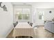 Bright dining room with natural light, neutral decor, and wood-look flooring at 7004 Everly Commons Ln, Tega Cay, SC 29708