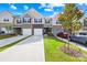 Attractive townhome exteriors with attached garages and well-maintained landscaping at 7004 Everly Commons Ln, Tega Cay, SC 29708