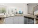 Open kitchen with granite countertops, stainless steel appliances and view of the living area at 7004 Everly Commons Ln, Tega Cay, SC 29708