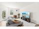 Bright living room with comfortable seating and large TV at 7004 Everly Commons Ln, Tega Cay, SC 29708