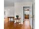 Open living area with hardwood floors, neutral walls, and a doorway view to the kitchen at 7209 Marley Cir, Charlotte, NC 28214