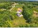 Overhead view of the home and its surrounding pasture and trees at 725 Bradshaw Rd, Mt Ulla, NC 28125