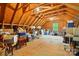 Unfinished attic space providing ample storage, natural light, and exposed wooden beams at 725 Bradshaw Rd, Mt Ulla, NC 28125