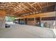 Interior barn view highlighting wooden horse stalls and concrete floors at 725 Bradshaw Rd, Mt Ulla, NC 28125