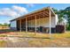 Barn shed featuring swings and storage area for tools and equipment at 725 Bradshaw Rd, Mt Ulla, NC 28125