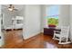 Cozy bedroom with hardwood floors, bunk beds, and a window with a view at 725 Bradshaw Rd, Mt Ulla, NC 28125