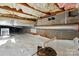 Clean crawl space with white plastic, insulation, exposed pipes, and block foundation at 725 Bradshaw Rd, Mt Ulla, NC 28125