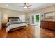 Spacious main bedroom features hardwood floors, ensuite bathroom and private deck access at 725 Bradshaw Rd, Mt Ulla, NC 28125