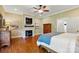 Relaxing main bedroom boasts hardwood floors, a fireplace, television and a large closet at 725 Bradshaw Rd, Mt Ulla, NC 28125