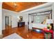 This bedroom has wood flooring, a four-poster bed, and a wood ceiling at 725 Bradshaw Rd, Mt Ulla, NC 28125
