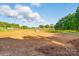 Pasture and wooded area on a sunny day with clear blue skies at 725 Bradshaw Rd, Mt Ulla, NC 28125