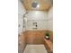 Walk-in shower features a built-in bench, shower head and hand shower and tiled surround at 725 Bradshaw Rd, Mt Ulla, NC 28125