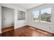 Bedroom with wood floors, large windows and closet at 7309 Pebblestone Dr # D, Charlotte, NC 28212