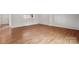 Bedroom with wood floors, large window, and closet at 7309 Pebblestone Dr # D, Charlotte, NC 28212