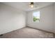 Cozy bedroom with a bright window and plush carpeting at 7309 Pebblestone Dr # D, Charlotte, NC 28212
