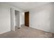 Bedroom featuring carpeted floor and a closet, offering storage at 7309 Pebblestone Dr # D, Charlotte, NC 28212