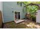Home exterior shot featuring the back patio and a large sliding glass door at 7309 Pebblestone Dr # D, Charlotte, NC 28212