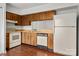 Functional kitchen featuring wood cabinets, laminate countertops, and a classic appliance package at 7309 Pebblestone Dr # D, Charlotte, NC 28212