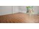 Spacious living area with wood floors and sliding glass door to back patio at 7309 Pebblestone Dr # D, Charlotte, NC 28212
