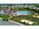 Overhead view of community pool area including a volleyball court, playground, clubhouse and seating at 7412 Greene Mill Sw Ave, Concord, NC 28025