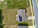 Aerial view of home showing roof with solar panels and the surrounding landscape at 7412 Greene Mill Sw Ave, Concord, NC 28025