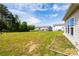 Spacious backyard featuring an expanse of well-maintained lawn, ideal for various outdoor activities and relaxation at 7412 Greene Mill Sw Ave, Concord, NC 28025