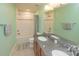 Bathroom featuring dual vanities, tiled shower and tub, and wood cabinets at 7412 Greene Mill Sw Ave, Concord, NC 28025