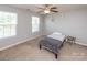 Bedroom featuring two windows offering natural light and neutral walls at 7412 Greene Mill Sw Ave, Concord, NC 28025