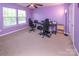 Bedroom featuring a ceiling fan, natural light, and carpeted floors at 7412 Greene Mill Sw Ave, Concord, NC 28025